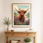 Finished highland cow meadow cross stitch artwork displayed as home decor