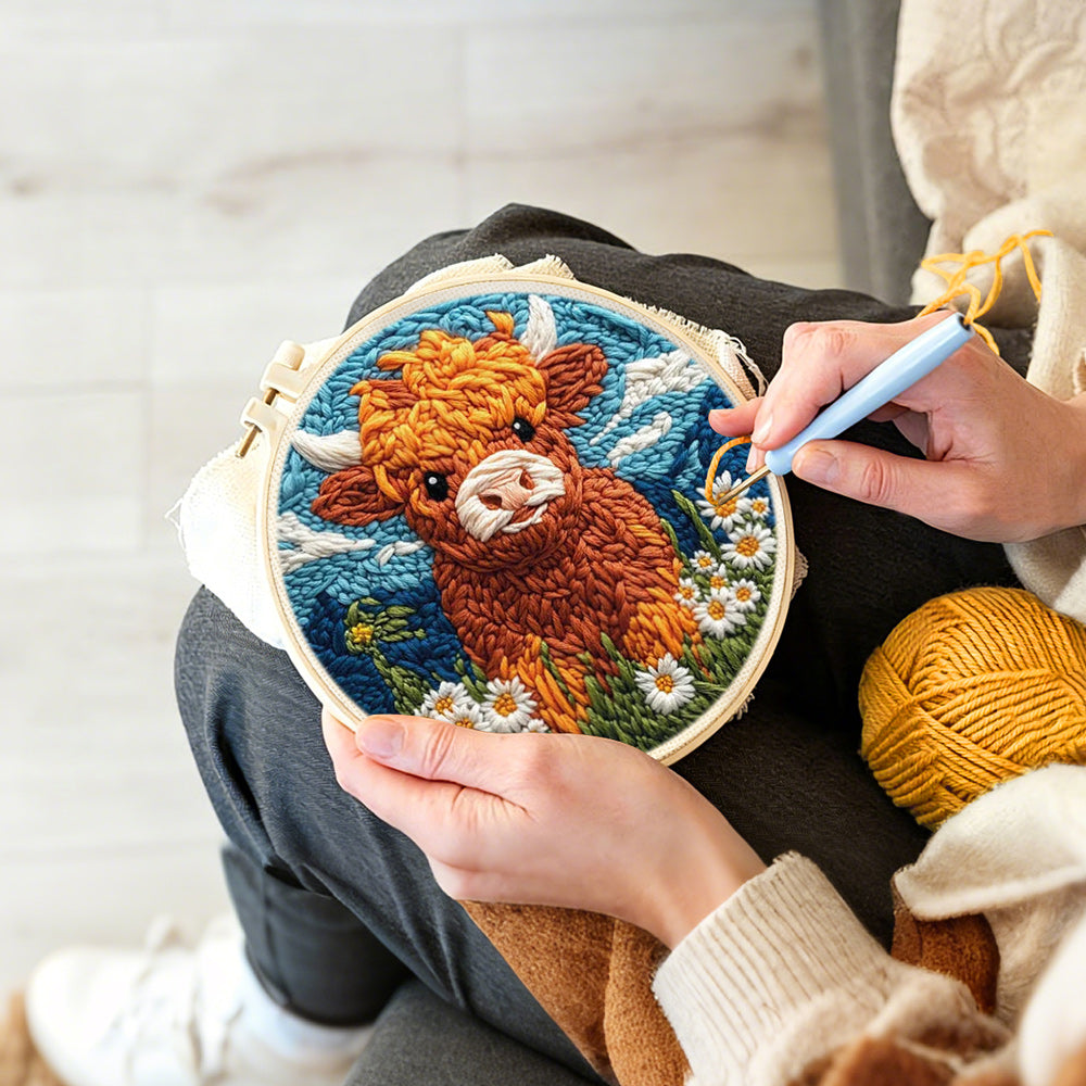 Creating handmade highland cow, mountains and daisies punch needle artwork