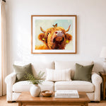 Finished highland cow with butterfly on head cross stitch artwork displayed as home decor