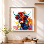 Finished highland cow with color splashes cross stitch artwork displayed as home decor