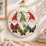 Holiday gnome trio embroidery hoop wall art displayed as warm and cozy handmade home decor