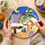 Creating the "home" sign and christmas tree cabin wool painting by hand with a felting needle