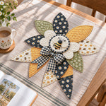 Honey bee handmade quilted bow displayed on a table as seasonal home decor