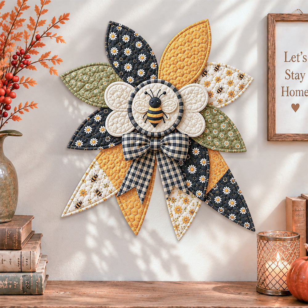Honey bee quilted bow displayed as handmade wall decor in a cozy home