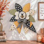 Honey bee quilted bow displayed as handmade wall decor in a cozy home