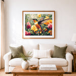 Finished hovering hummingbird in bright flowers cross stitch artwork displayed as home decor