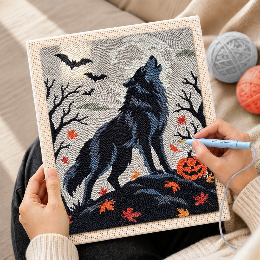 Creating handmade howling wolf on halloween night punch needle artwork