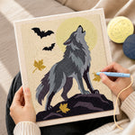 Creating handmade howling wolf under full moon punch needle artwork