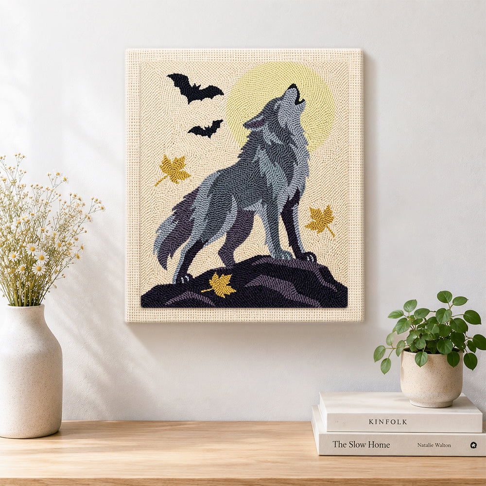 Finished howling wolf under full moon artwork displayed on a wall
