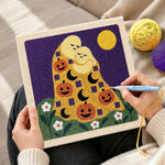 Creating handmade hugging ghosts with pumpkins punch needle artwork
