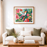 Finished hummingbird among pink blooms cross stitch artwork displayed as home decor