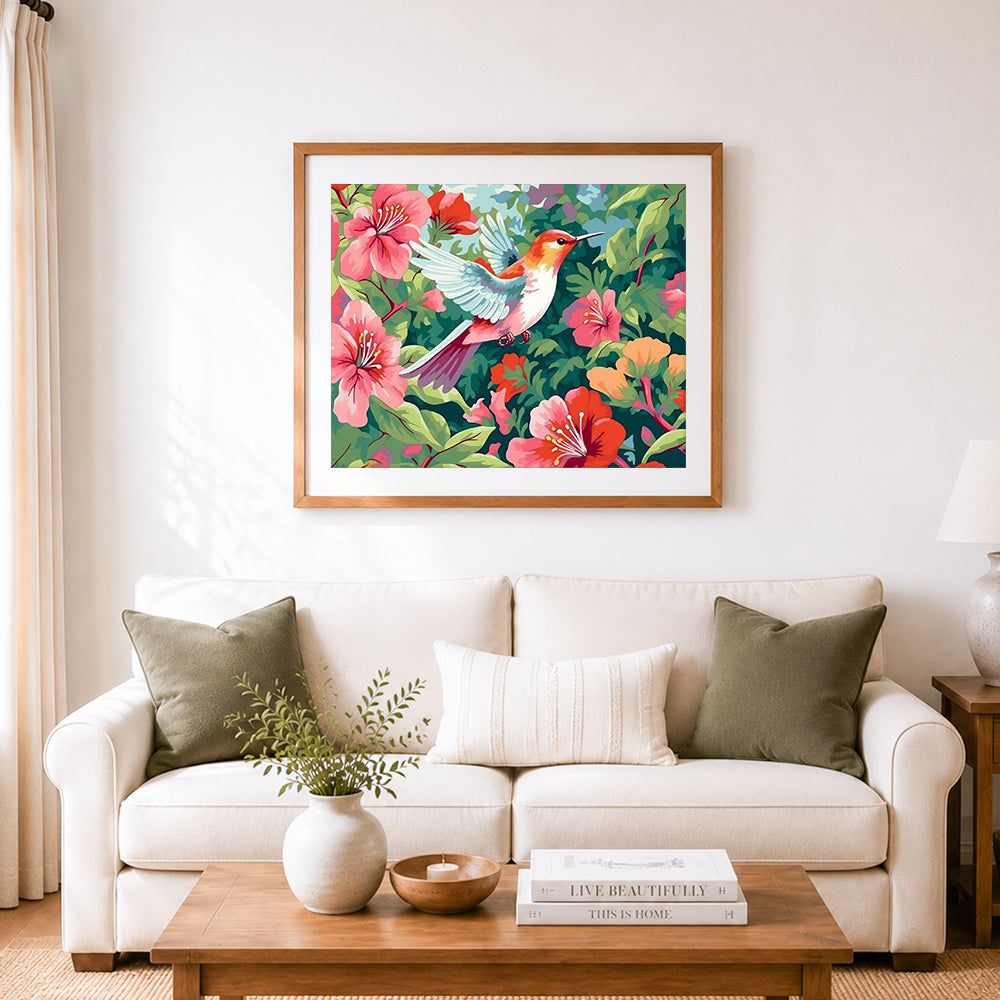 Finished hummingbird among pink blooms cross stitch artwork displayed as home decor