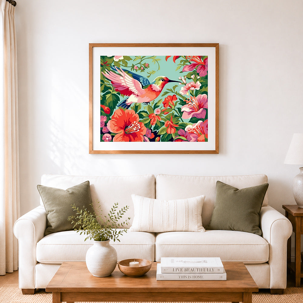 Finished hummingbird feeding on flowers cross stitch artwork displayed as home decor