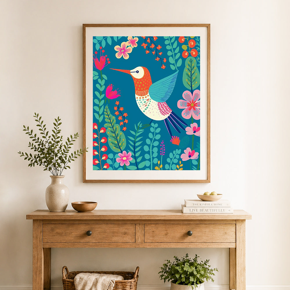 Finished hummingbird in floral jungle cross stitch artwork displayed as home decor