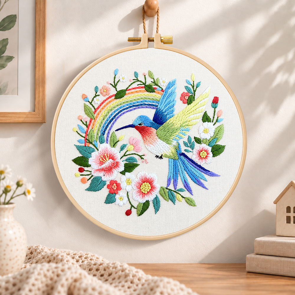 Hummingbird with rainbow embroidery hoop wall art displayed as warm and cozy handmade home decor