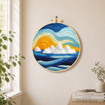 Icebergs at sunset needle felt wall art displayed in a bright home interior