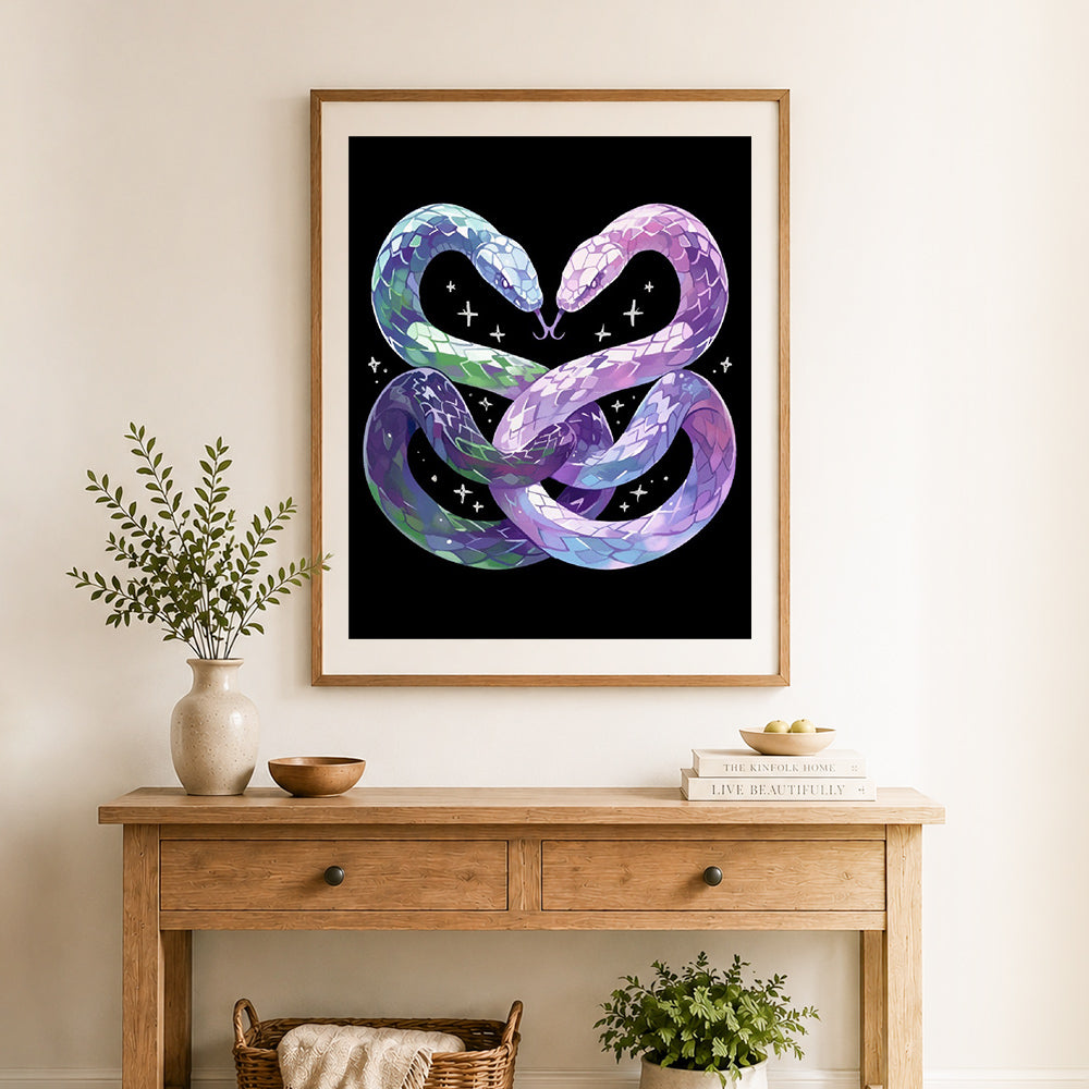 Finished infinity heart snakes cross stitch artwork displayed as home decor