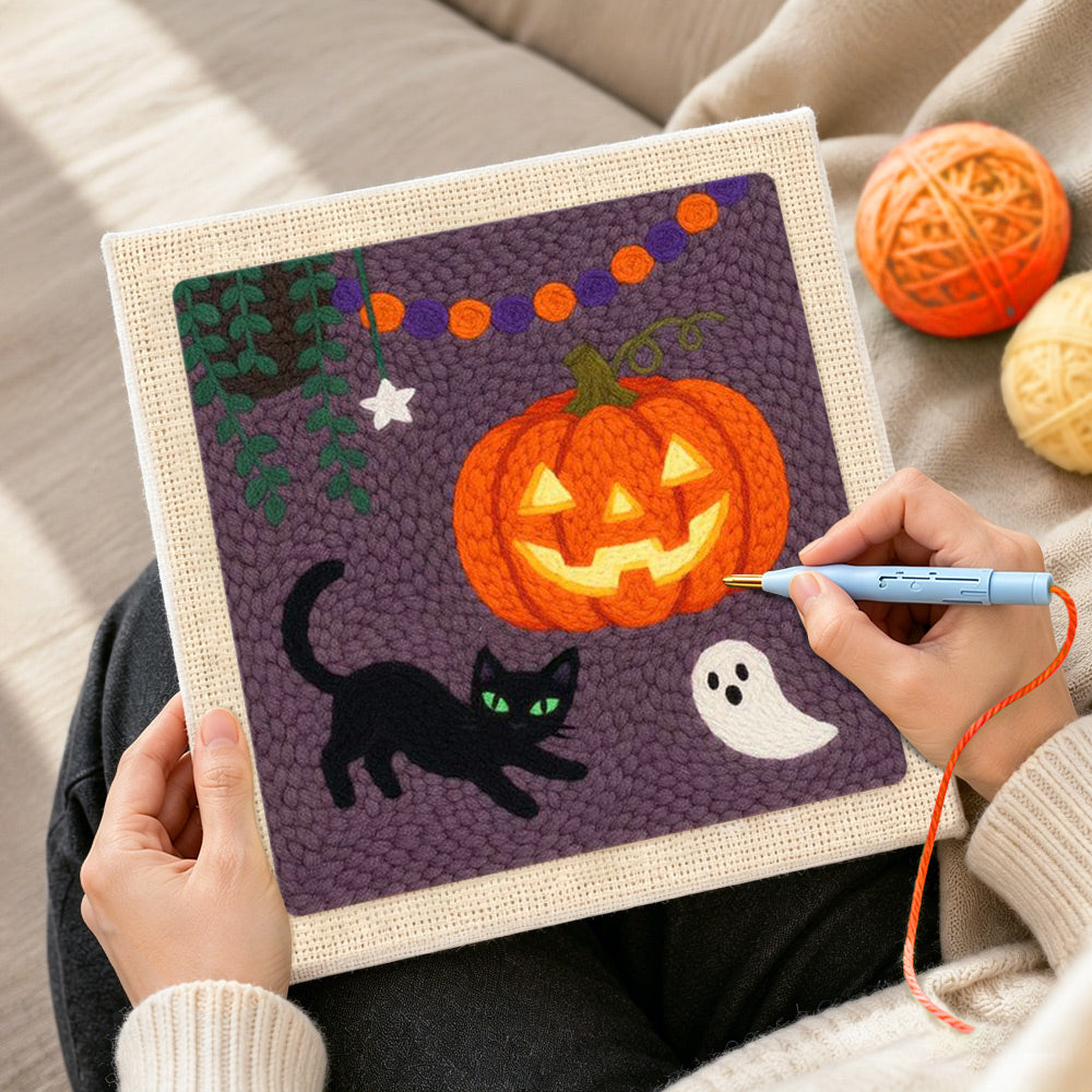 Creating handmade jack o lantern and cat punch needle artwork