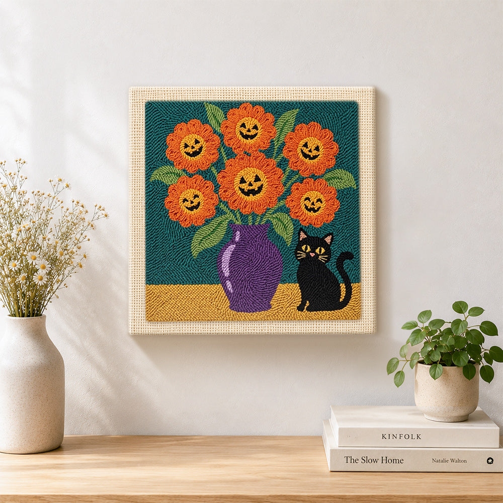 Finished jack‑o‑lantern blooms artwork displayed on a wall
