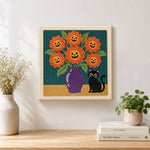 Finished jack‑o‑lantern blooms artwork displayed on a wall