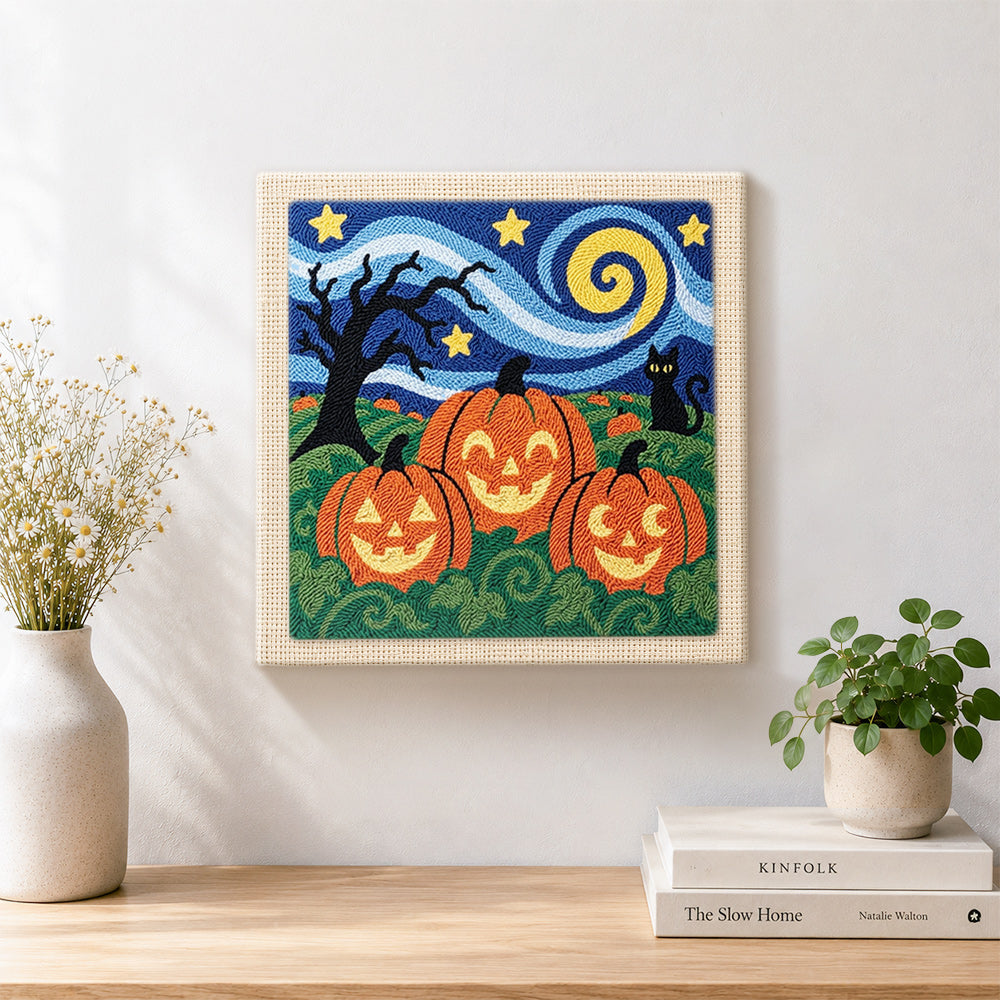 Finished jack‑o‑lantern field scene artwork displayed on a wall