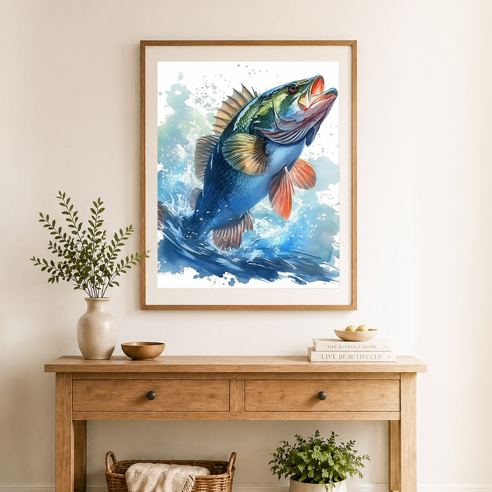 Finished jumping bass watercolor splash cross stitch artwork displayed as home decor