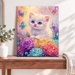 Finished kitten and rainbow butterflies pearl diamond painting artwork displayed as home decor