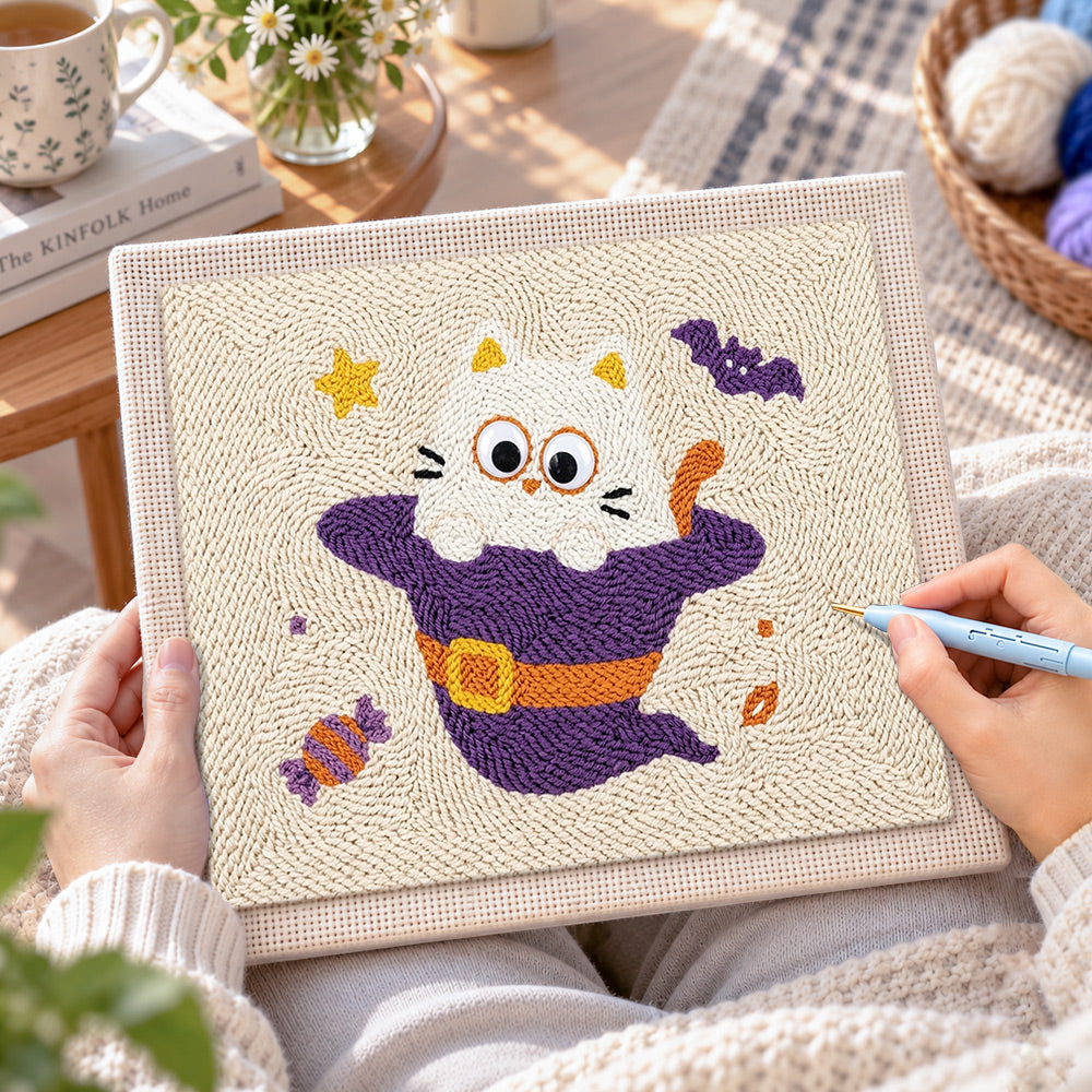 Creating handmade kitten in witch costume punch needle artwork