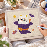 Creating handmade kitten in witch costume punch needle artwork