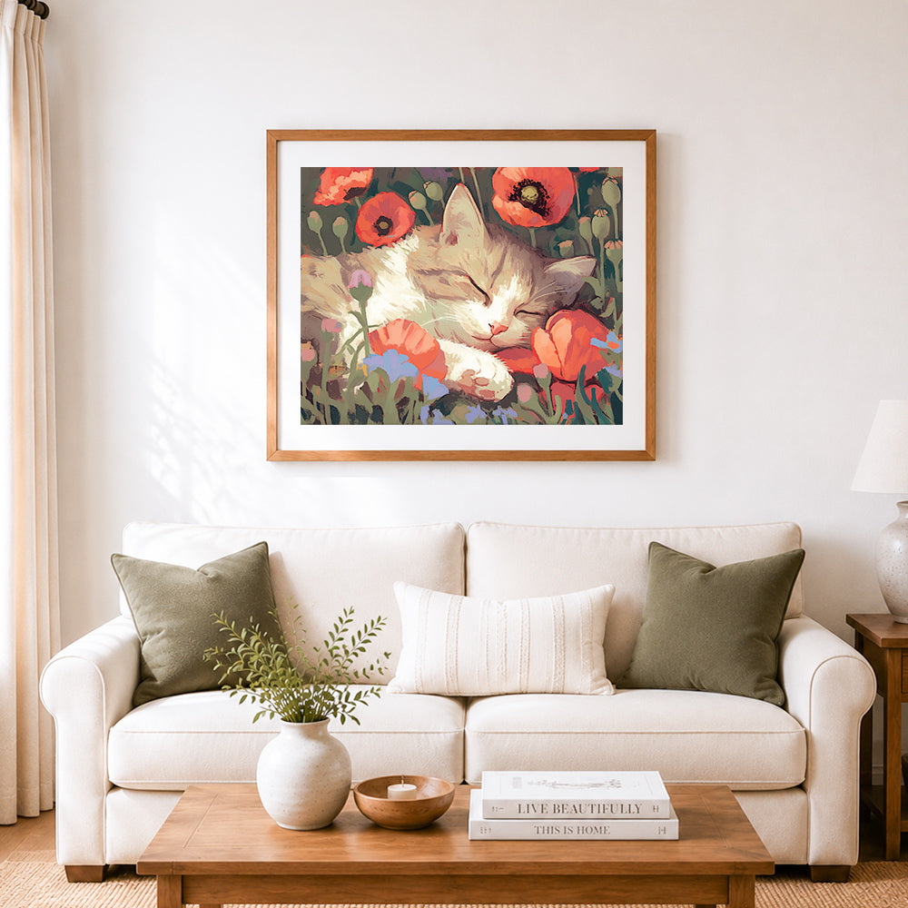Finished kitten napping among poppies cross stitch artwork displayed as home decor