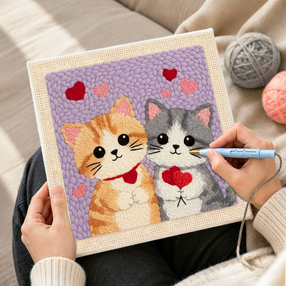 Creating handmade kittens holding hearts punch needle artwork