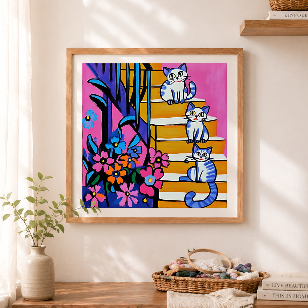 Finished kittens on bright stairs cross stitch artwork displayed as home decor