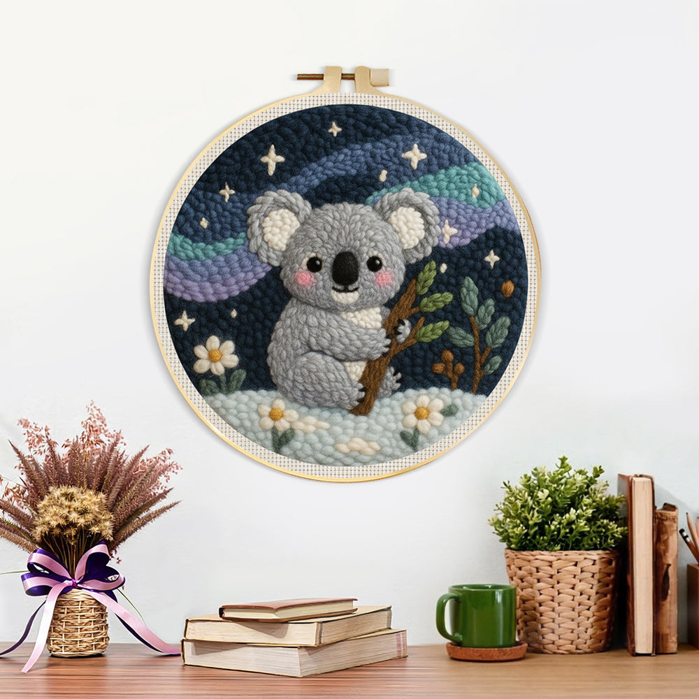 Finished koala and mountains under the stars artwork displayed on a wall