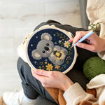 Creating handmade koala and wildflowers punch needle artwork