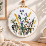 Lavender and wheat bouquet embroidery hoop wall art displayed as warm and cozy handmade home decor