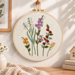 Lavender wildflower embroidery hoop wall art displayed as warm and cozy handmade home decor