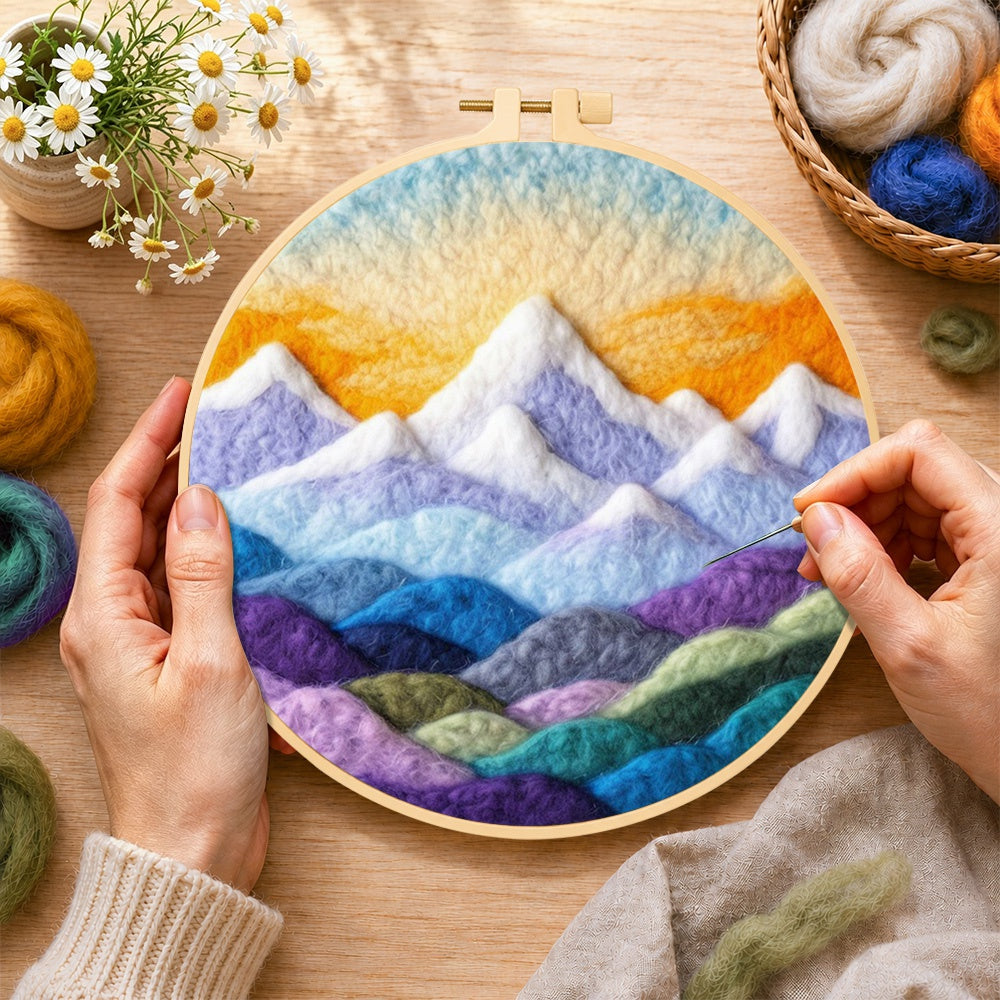 Creating the layered colorful mountain peaks at sunrise wool painting by hand with a felting needle