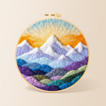 Layered colorful mountain peaks at sunrise needle felting kit for beginners with a round wooden frame