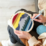Creating handmade layered mountain landscape punch needle artwork