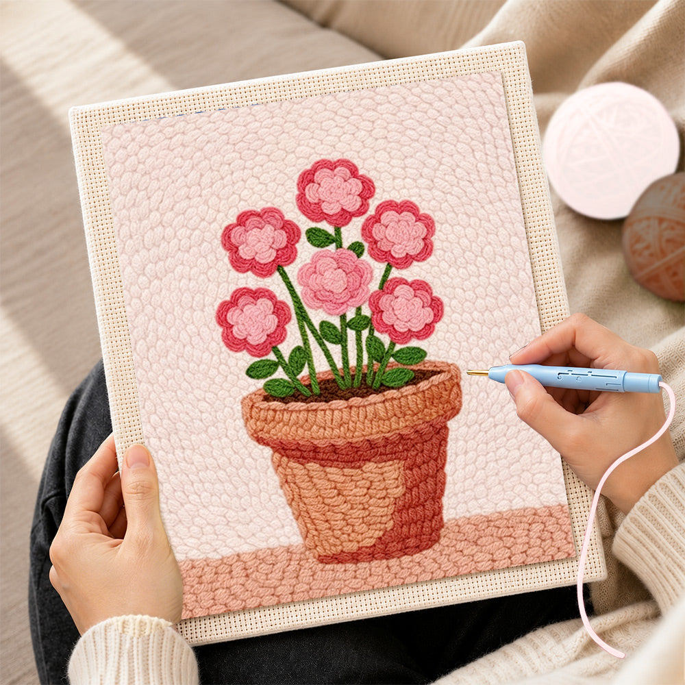 Creating handmade layered pink flowers in pot punch needle artwork