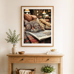 Finished lazy reading cat cross stitch artwork displayed as home decor