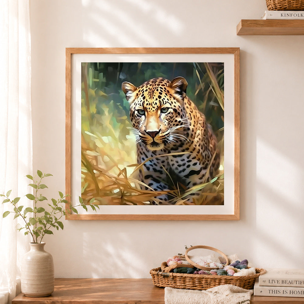 Finished leopard hiding in tall grass cross stitch artwork displayed as home decor