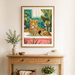 Finished leopard in bathtub cross stitch artwork displayed as home decor