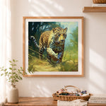 Finished leopard walking through grass cross stitch artwork displayed as home decor