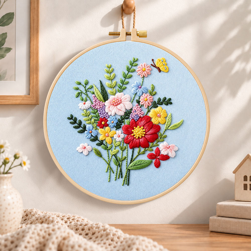 Light blue florals with butterfly embroidery hoop wall art displayed as warm and cozy handmade home decor