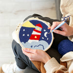 Creating handmade lighthouse at night punch needle artwork