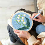 Creating handmade lily of the valley punch needle artwork