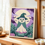 Little ghost witch under full moon punch needle artwork displayed on a table