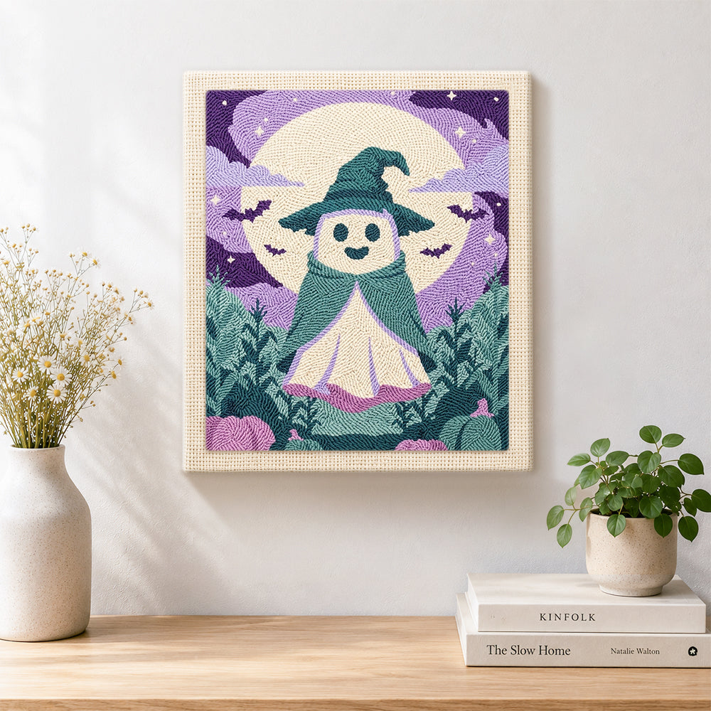 Finished little ghost witch under full moon artwork displayed on a wall