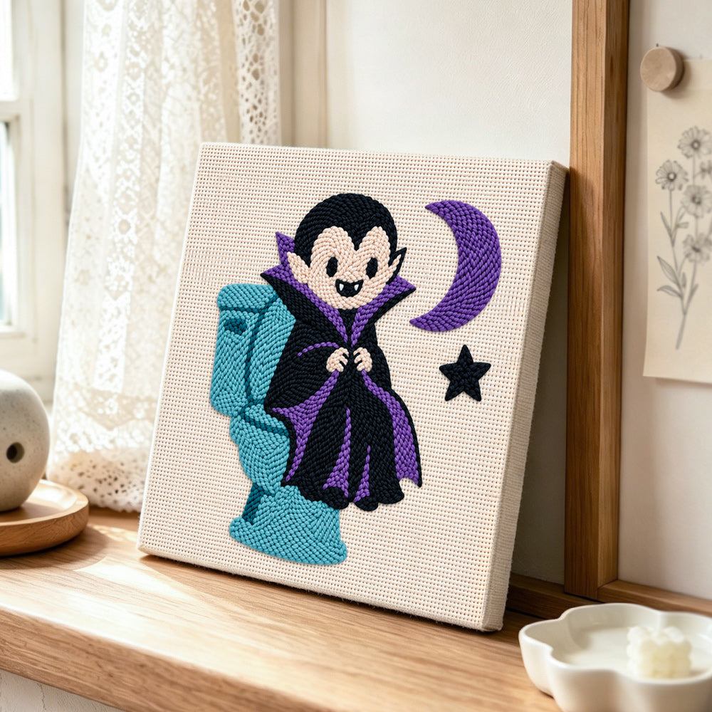 Little vampire on toilet punch needle artwork displayed on a table